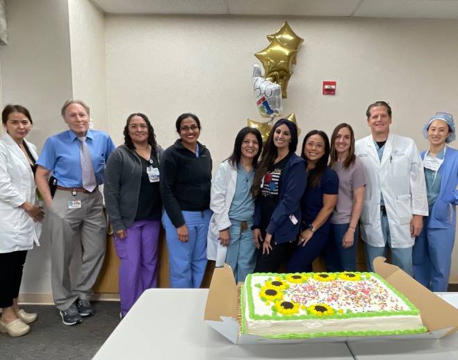 Healthcare team celebrating with cake