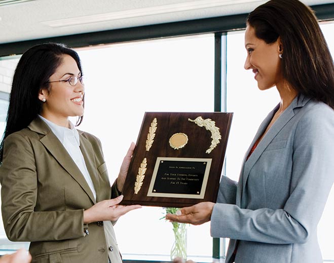 Employee receiving workplace achievement award