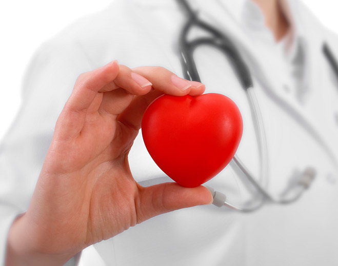 Healthcare provider holding heart health symbol