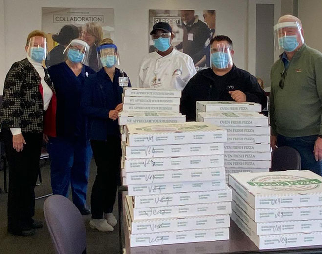 Healthcare workers receiving community meal donation