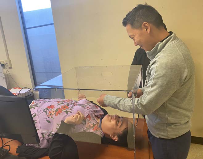 Medical professional assisting patient evaluation