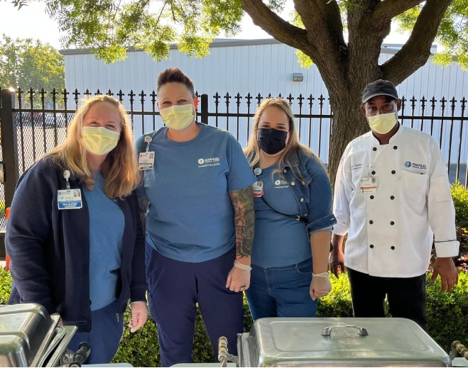 Hospital staff serving community appreciation meal