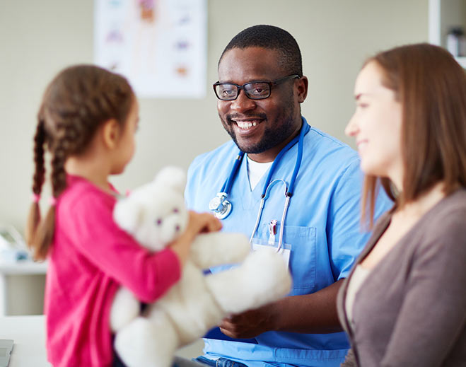 Pediatric healthcare provider with child patient