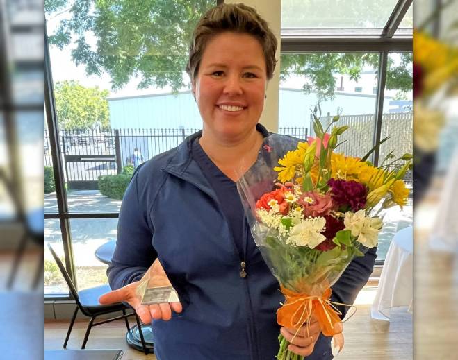 Stephanie Childress holding flowers