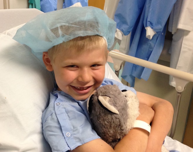 Child awaiting surgery with stuffed animal