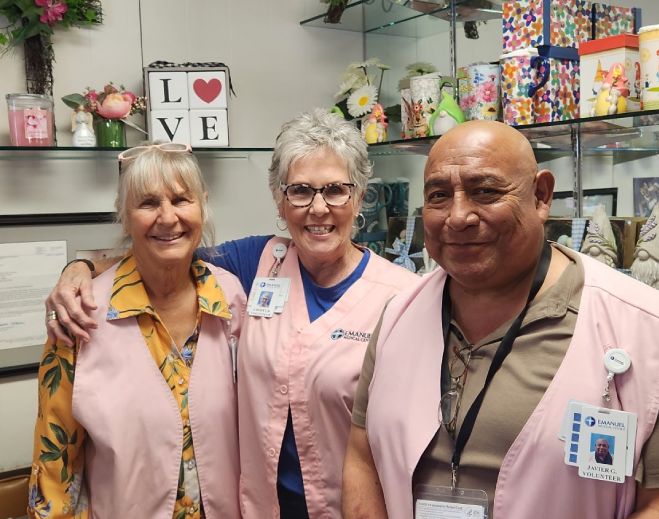 Volunteers posing together inside gift shop