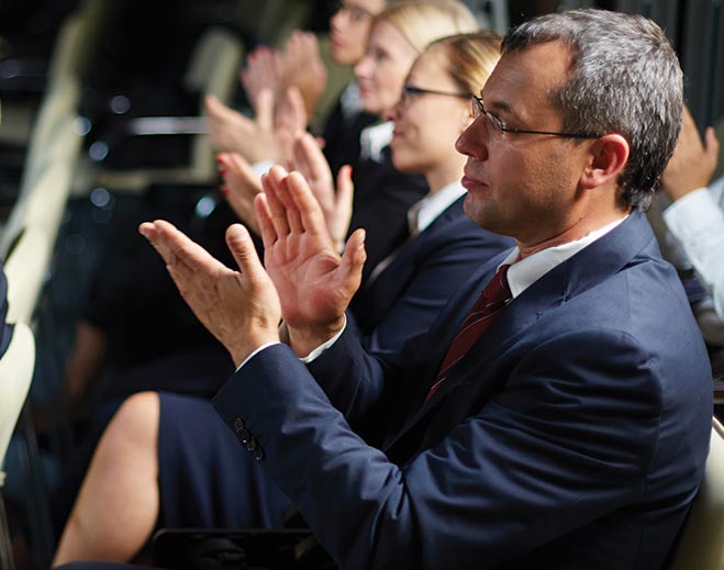 Audience applauding during recognition event