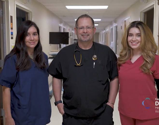 Healthcare staff standing in hallway