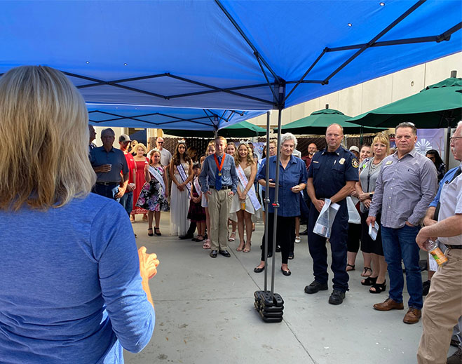 Community gathering at outdoor hospital event