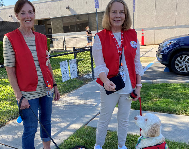 Pet therapy volunteers with therapy dog